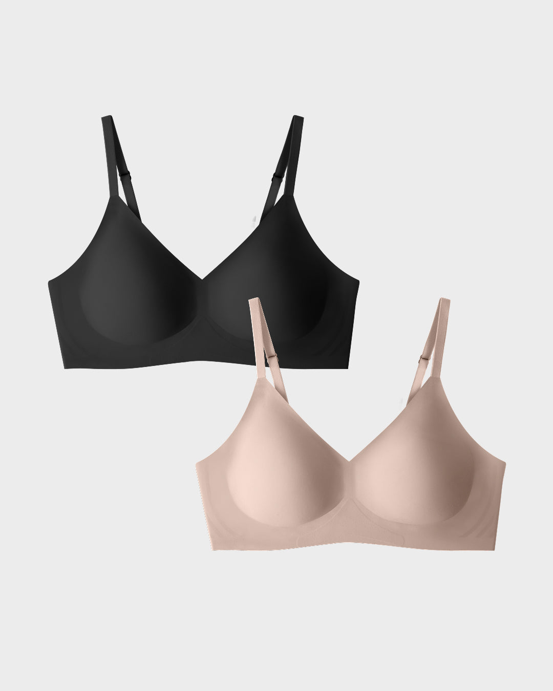 EBY seamless bralettes in black and nude laid flat